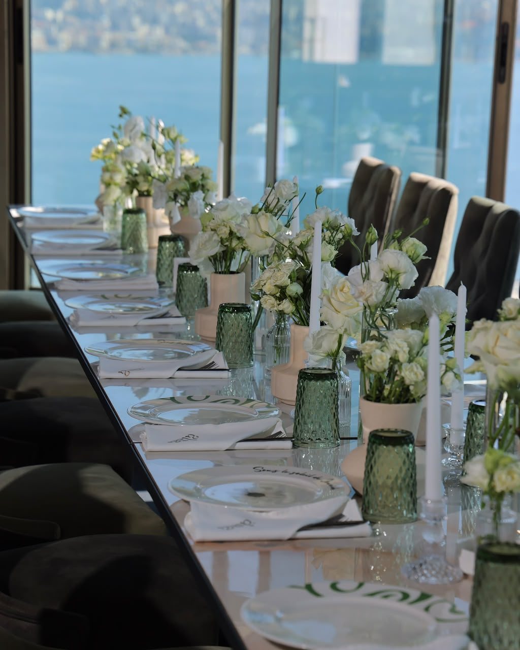 Long ALSA table with white flowers facing Jounieh Bay
