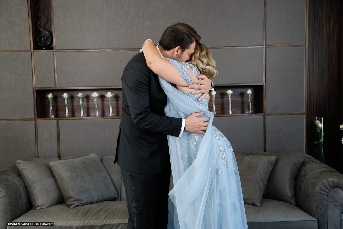 Bride and groom embracing in the Lobby Lounge